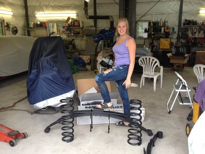 amy inspecting the new rear leafs and front coils.jpg